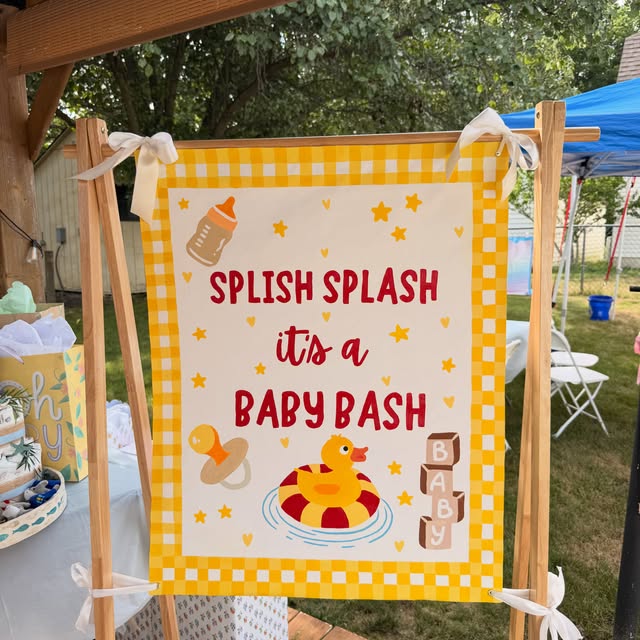 Yellow gingham baby shower banner with duck and bottle details
