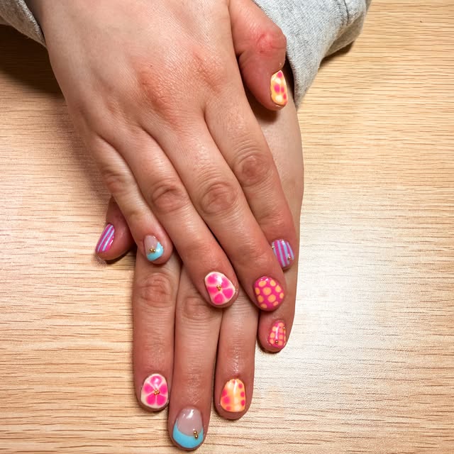 Pink and orange patterned nail art